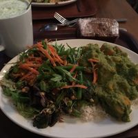 Spinach stew over rice, two salads, banana and sultana bread and matcha latte  at Cornucopia in Dublin
