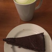 Vegan raw chocolate cake and matcha latte with soy milk  at Cornucopia in Dublin