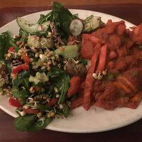 Autumn veg stew - sweet potato, chickpea and parsnip stew in a tomato and roast beetroot sauce on brown  rice with radish and sprout salad  at Cornucopia in Dublin