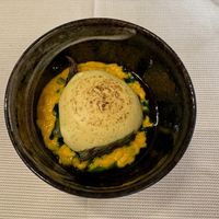 "Anima Mundi" - Risotto with carrot cream, charred asparagus, wild garlic emulsion, and a soft curry mousse at Joia Alta Cucina Naturale in Milan