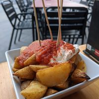 Patatas bravas:
Papas asadas al horno con salsa casera at Jardin Urbano in Valencia