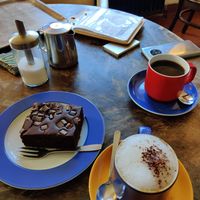 Vegan chocolate cake, oatmilk cappuccino & black coffee at Cafe am Grün in Marburg