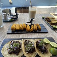 Elotes, tacos de Jamaica, and tacos de falafel al pastor.   at Capuchino Cafe in La Paz