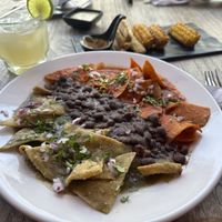 Chilaquiles divorciados, elotes, and margarita   at Capuchino Cafe in La Paz