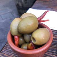 I had to pull the peppers out bc they were so hot 😆 but they sure look pretty and the olives tasted great!  at The Franciscan Well Brewery in Cork