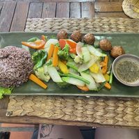 Vegan veggies and omn! meatballs with brown rice option  at New Leaf Eatery in Siem Reap
