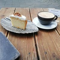 Lemon cake and oatmylk cappucchino at Brocca Cafe in Berlin