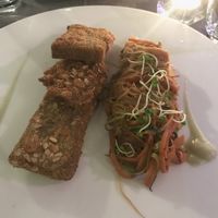 Breaded seitan cutlets with rice noodles at Il Margutta in Rome