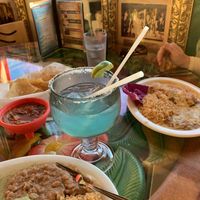 Marina margarita, with blue curaçao. Complimentary chips and salsa. Non-vegan potato enchiladas w/cheese. at Olamendi's Mexican Restaurant in Dana Point