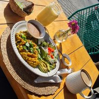 Tofu scrambled 'eggs' with bread, tropical juice and coffee with oat milk at Nomada Organics & Gourmet in La Paz