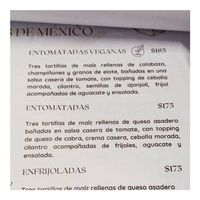 Entomadas description: 3 corn tortillas stuffed with zuchini, mushrooms, & corn. Smothered in tomato sauce. at Nomada Organics & Gourmet in La Paz