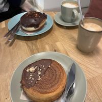 Croissant de avellana y chocolate, y otro donut con chocolate  at Delish Vegan Doughnuts in Madrid