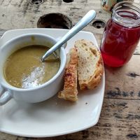 Cream of vegetable soup, bread, Jamaica drink at Naturalia Cafe in Medellin