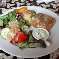 North African dish: couscous, a puff pastry with vegetables and tofu, salad and vegan raita at Bolhoed in Amsterdam