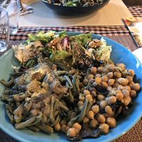 Buddha bowl with spirulina pasta, chickpeas and mushrooms and salad  at El Brot in Alp