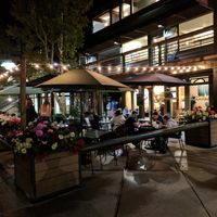 Outdoor seating area at night  at The Stew Pot in Snowmass Village