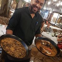 Mushroom risotto to the left, very delicious. The right is seafood paella. at Can Sabata in Lloret De Mar