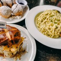 Truffle burger, ube beignets, linguini pasta with Beyond bratwurst  at CyBelle's Front Room in San Francisco