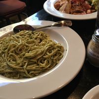 Pesto linguini, cashew Parmesan and vegan nachos at CyBelle's Front Room in San Francisco