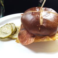 Vegan twice as nice sandwich: two mung bean eggs, two pieces of bacon, and cheese on a pretzel bun at CyBelle's Front Room in San Francisco
