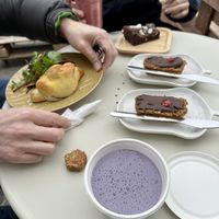Blueberry pupshake and doggy treat in foreground   at Square Roots in Whitley Bay