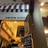 The shop with the owners and menu. at Union Kiosk in Melbourne