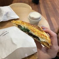 Mushroom + basil + mozzarella jaffle with hot choc  at Union Kiosk in Melbourne