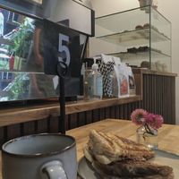Vegan bean and cheese jaffle with a cup of coffee  at Union Kiosk in Melbourne