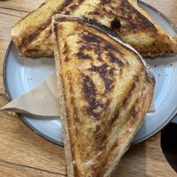 Tofu scramble jaffle - has ham and hollandaise sauce inside  at Union Kiosk in Melbourne