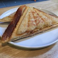 Vegan 'apple pie' jaffle with stewed apple and custard filling at Union Kiosk in Melbourne