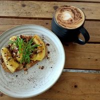 Oat milk latte and peanut butter toast with caramelised banana at The Factory Cafe in Koh Tao