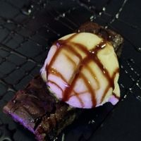 Vegan chocolate brownie and ice cream at Rock Garden in Torquay