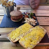 Vegan burger and cheesy garlic bread  at Rock Garden in Torquay