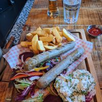 Vegan sausage fest with vegan coleslaw and chunky chips at Einstein's in Chesterfield