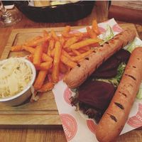 Vegan bratwurst with beet salad, sweet pot fries and sauerkraut  at Einstein's in Chesterfield