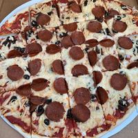 Vegan thin crust with behive pepperoni, black olives, and onions  at 312 Pizza Company in Nashville