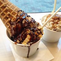 A triple scoop with a waffle cone and double scoop with pumpkin spice syrup. at Monkeywrench in Salt Lake City