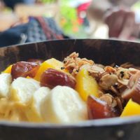 Dterm Pa-lang strength and power, smoothie bowl with peanut butter, dates, oats, banana, mango, coconut water & homemade granola at Bom Bowls in Pai