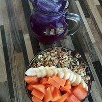 Acai bowl with extra fruit and butterfly pea cold tea  at Bom Bowls in Pai