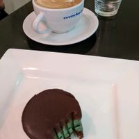 Choc Peppermint slice, and a flat white. at Orchid Vegetarian Cafe in Surfers Paradise