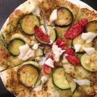Zucchini pesto pizza with vegan cheese at Orchid Vegetarian Cafe in Surfers Paradise
