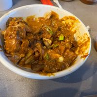 I believe this to be the "butter" curry that appeared on the table without explanation. Was good. at Foo Dog Curry Traders in Jacksonville