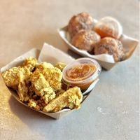 Crispy Jackfruit Nuggets with curry ketchup and Rice A Rollies with sweet chili sauce. at Foo Dog Curry Traders in Jacksonville