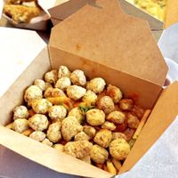 Butter Chicken over Fries with vegan popcorn chicken. at Foo Dog Curry Traders in Jacksonville