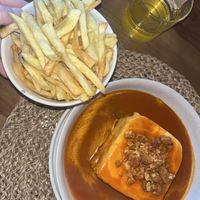 Francesinha and fries   at O Porto dos Gatos in Porto