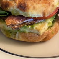 Pesto breakfast sandwich - bacon added. I am a complete fiend for this! at Cafe Red in Seattle