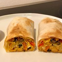 bacon breakfast burrito (plated at home) at Cafe Red in Seattle