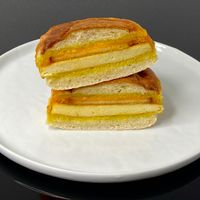 bacon breakfast sandwich (plated at home) at Cafe Red in Seattle