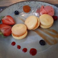 Macaroons with lemon filling served with fresh berries and fruit sorbet at Gaia in Narbonne