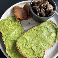 Avo toast with house bacon and mushrooms   at Shift Eatery in Surry Hills